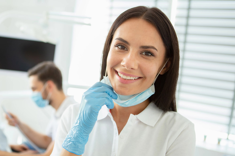 Smiling orthodontic assistant in office
